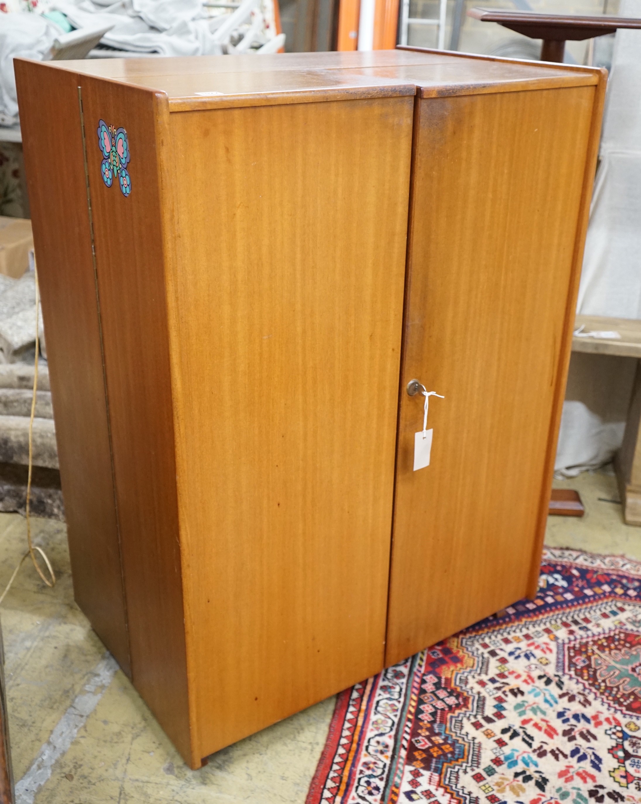 A mid century teak 'Magic Box' enclosed desk, width 82cm, depth 54cm, height 115cm